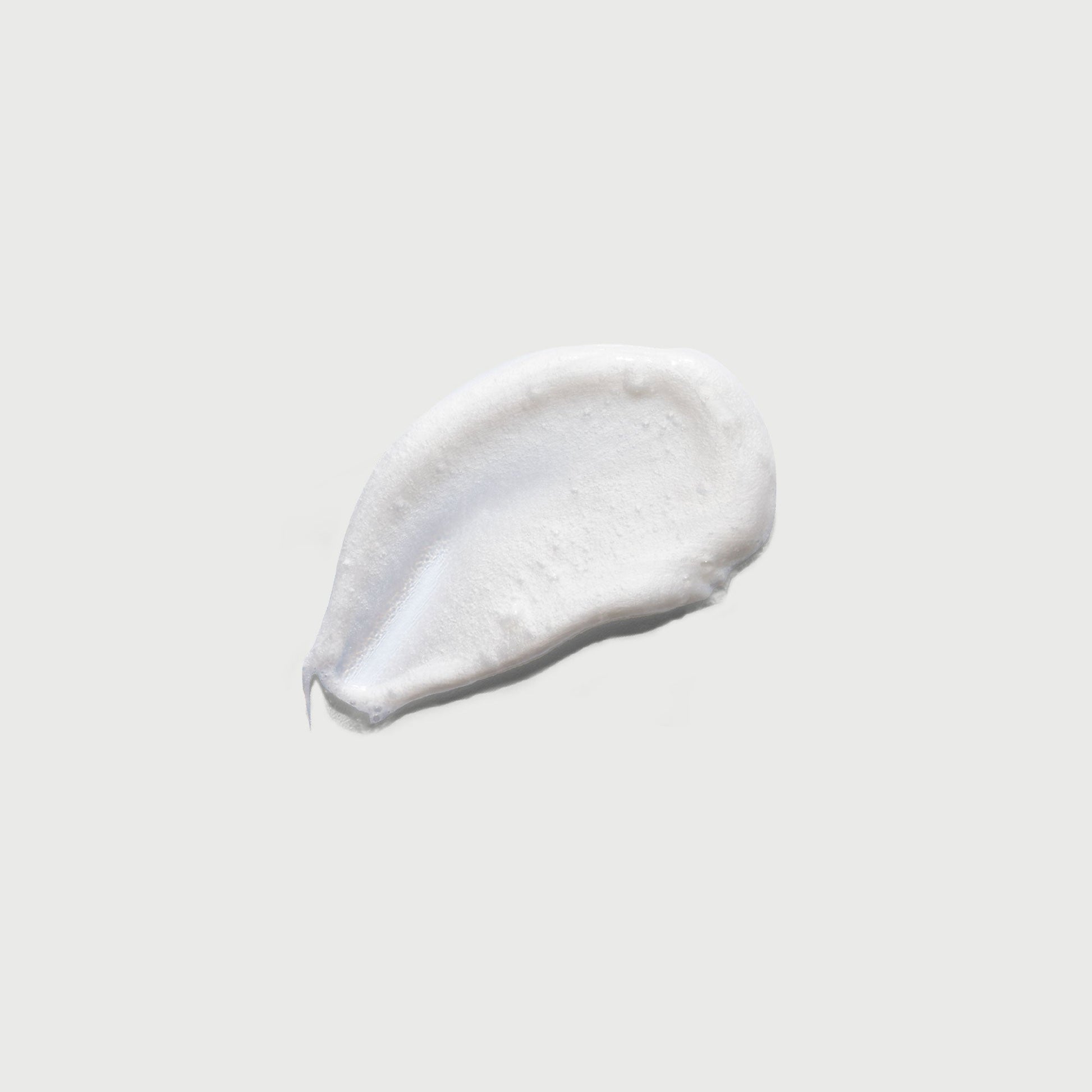 the-smoother-glycolic-acid-exfoliating-body-wash-l6 NATR-40002-Swatch-The-Smoother-Glycolic-Acid-Exfoliating-Body-Wash-bonebkgd.jpg